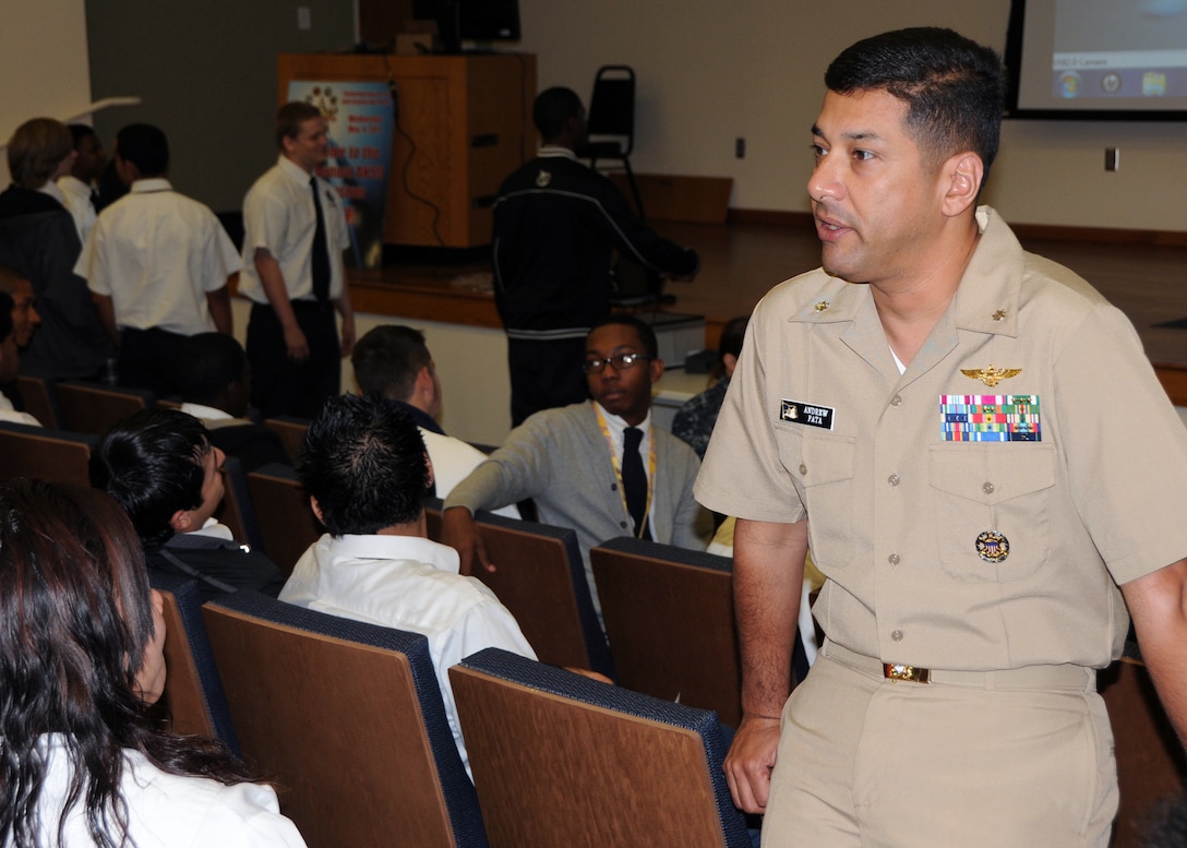 Navy flight surgeon LtCmdr. Andrew Fata, talks about his job with area high school students who attended the Association of Naval Service Officers “Youth Day,” which was held at the Medical Education and Training Campus aboard Fort Sam Houston, May 4, 2011, in San Antonio.